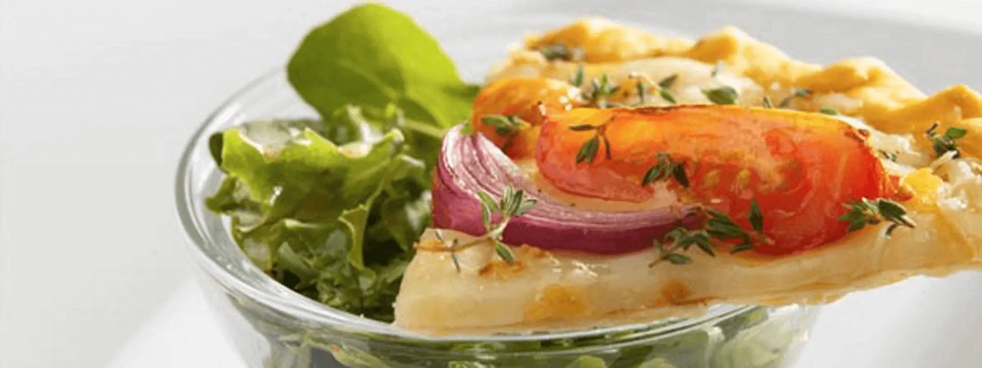 Roasted Tomato and Cheese Tart On A Bowl Of Glass