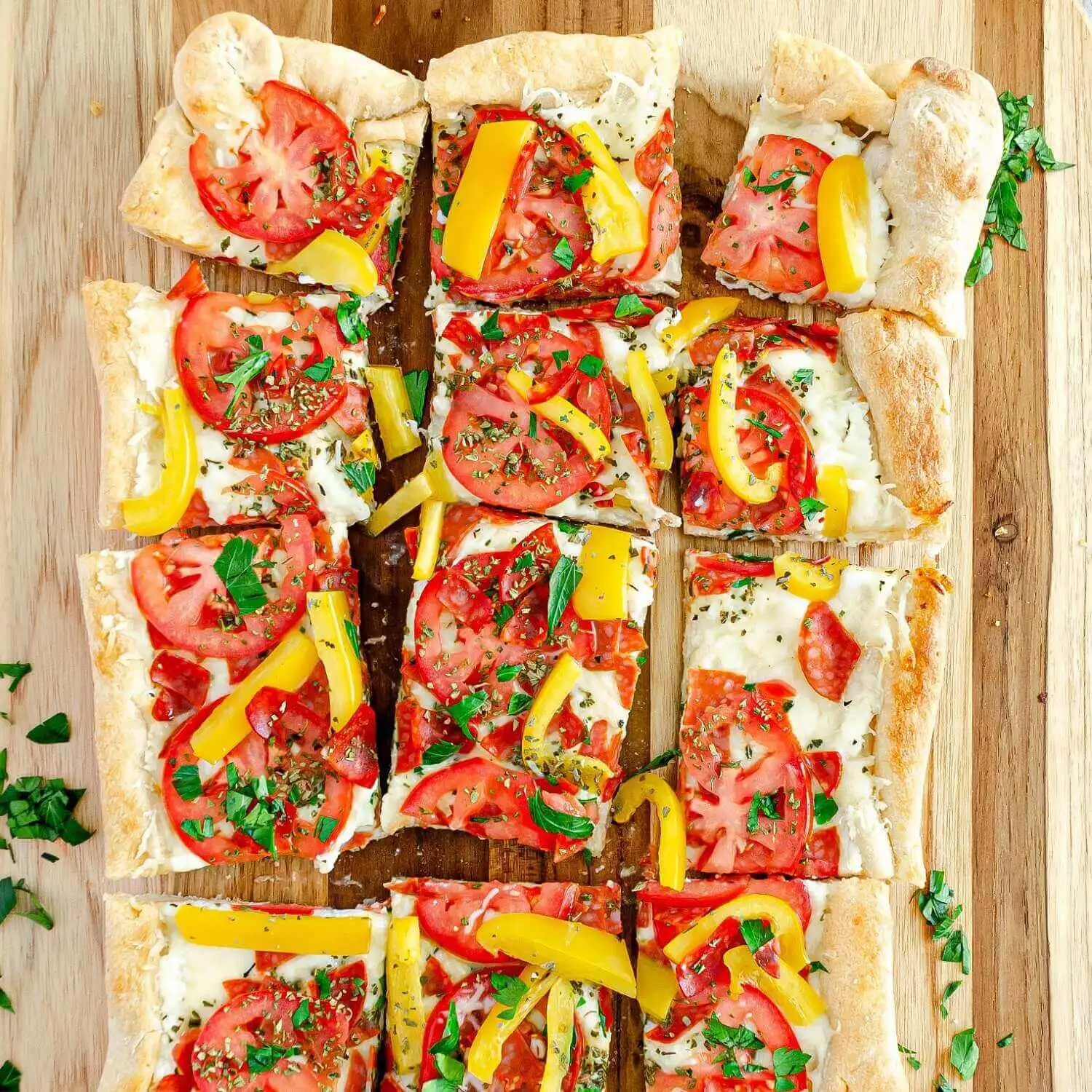 Squared Cheese Pizza On A Wood Table